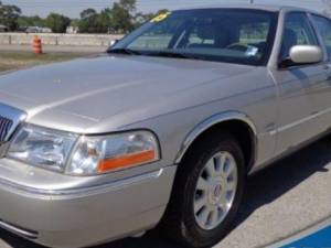 Mercury Grand Marquis 2003-2006, 4-door, Sedan, LS (4 piece Molded Stainless Steel Wheel Well Fender Trim Molding 1.75" Width, Short Style, The Fender Trim is fitted above the factory molding (cladding) On the LS model Clip on or screw in installation, Lo